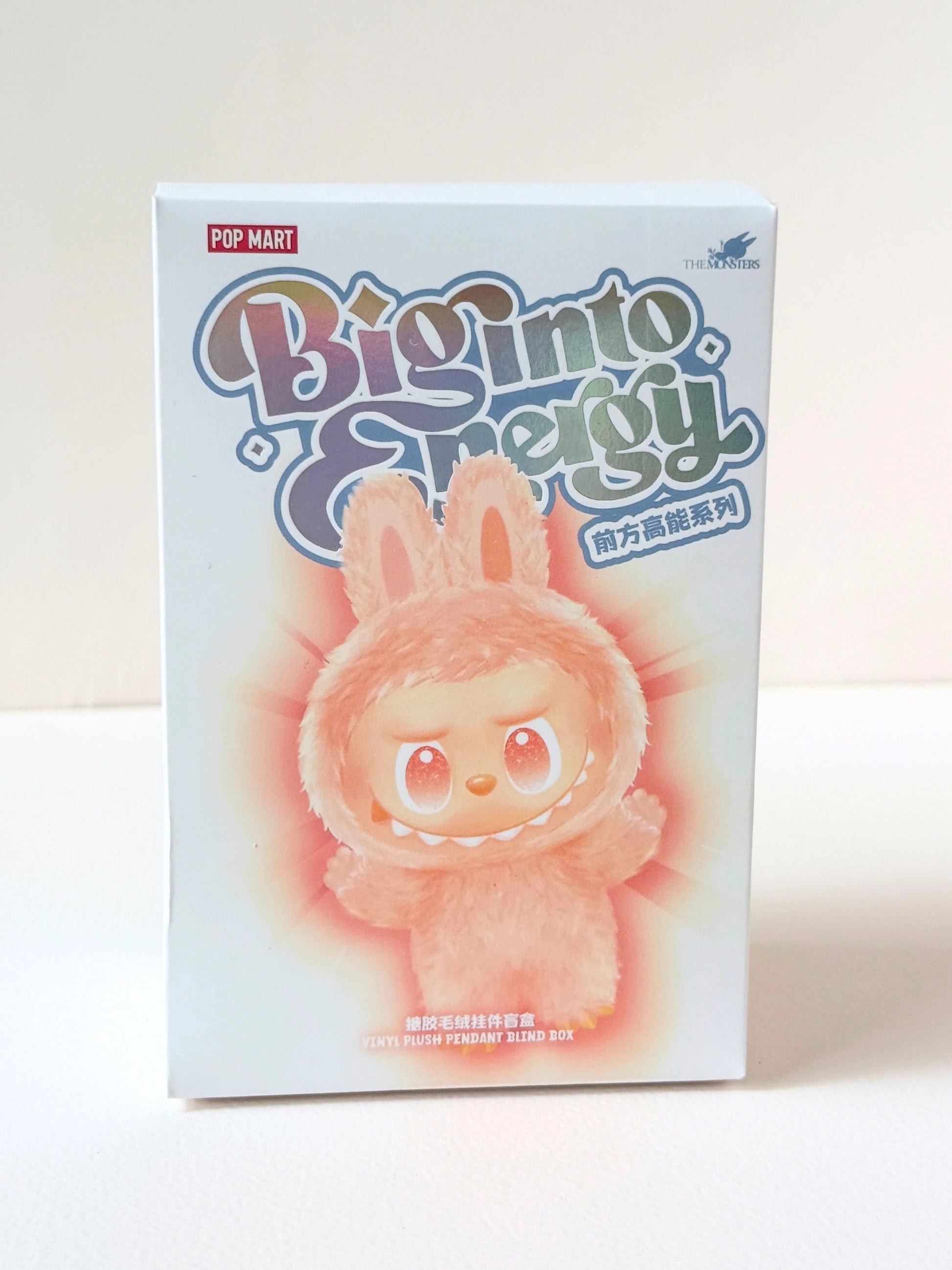 Box of a plush toy with 'Big into Energy' branding on a white background